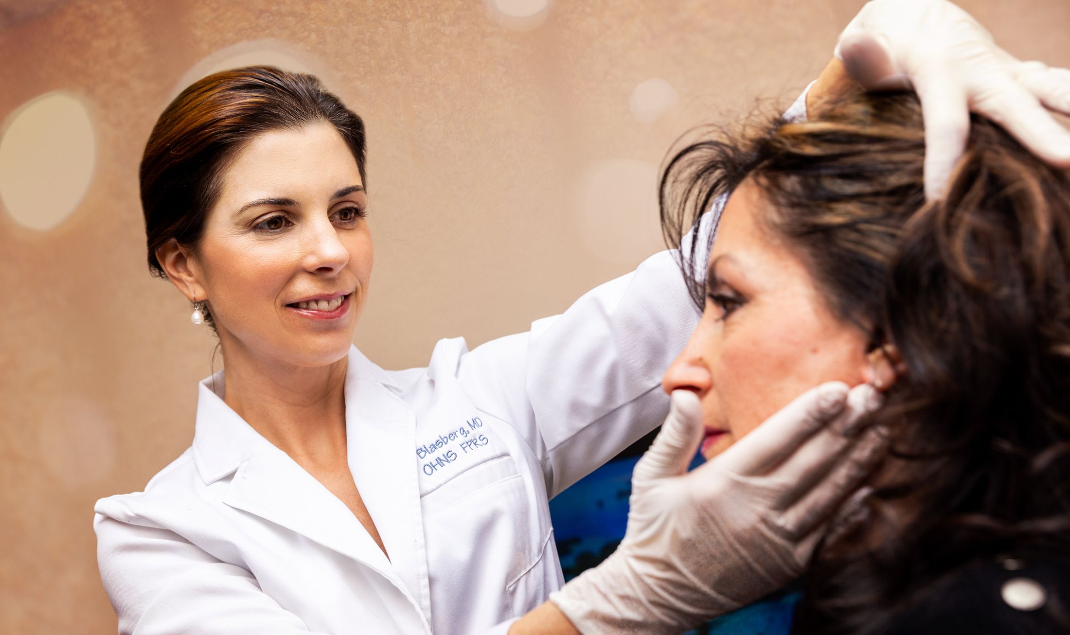 Doctor consulting with patient about skincare treatment.